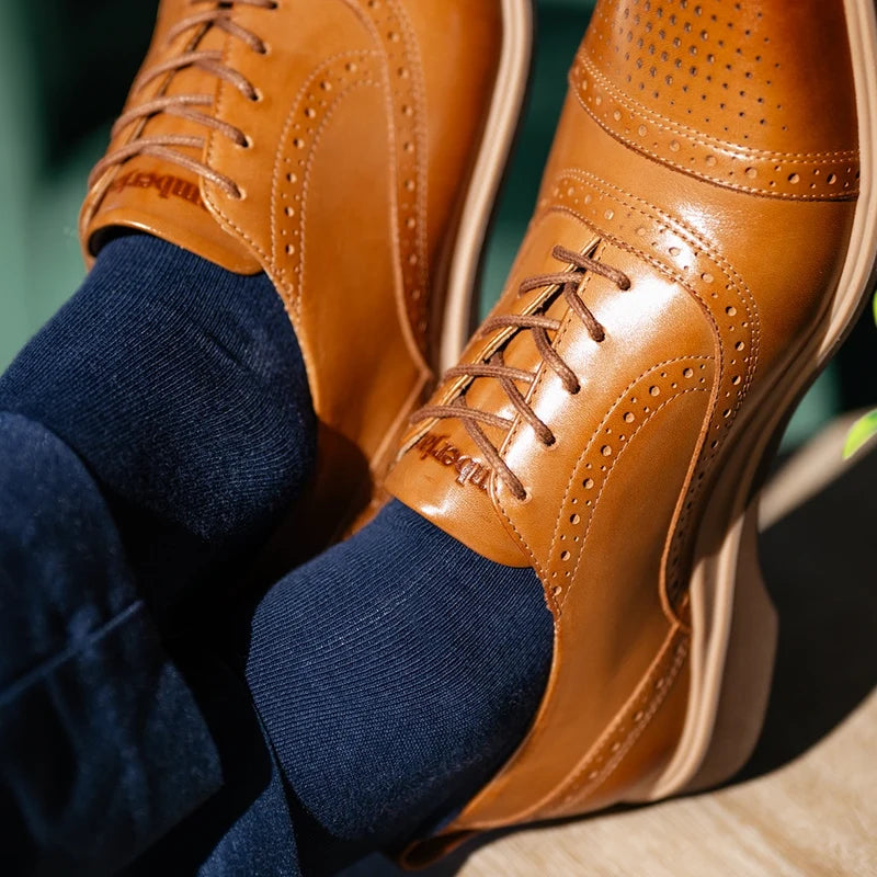 close up detail photos of Amberjack Dress Socks in Cobalt paired with The CapToe Honey