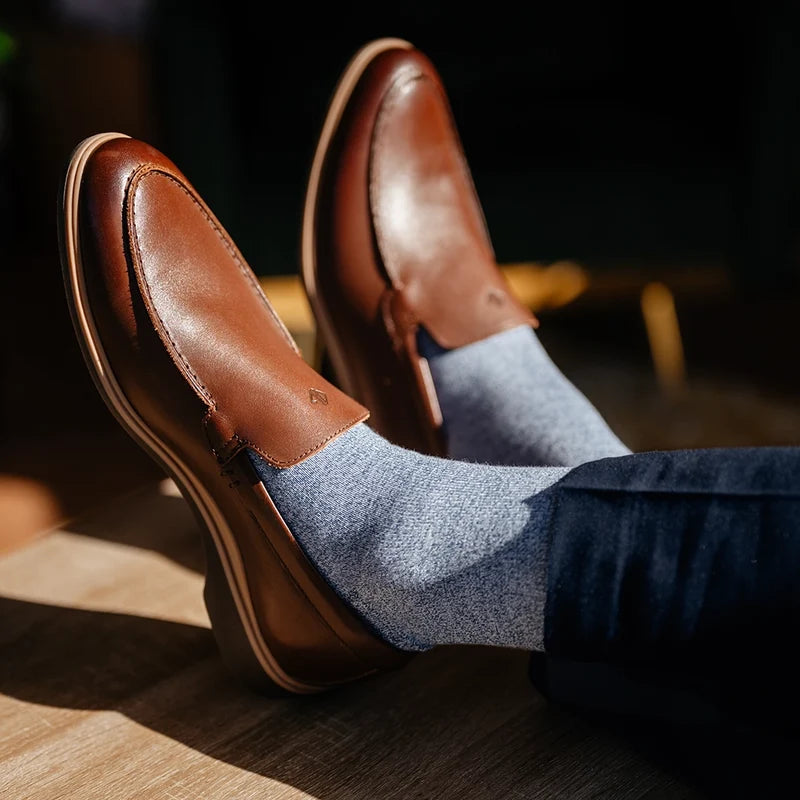 close up detail photos of Amberjack Dress Socks in Ocean paired with The Slip-On Chestnut and navy dress pants
