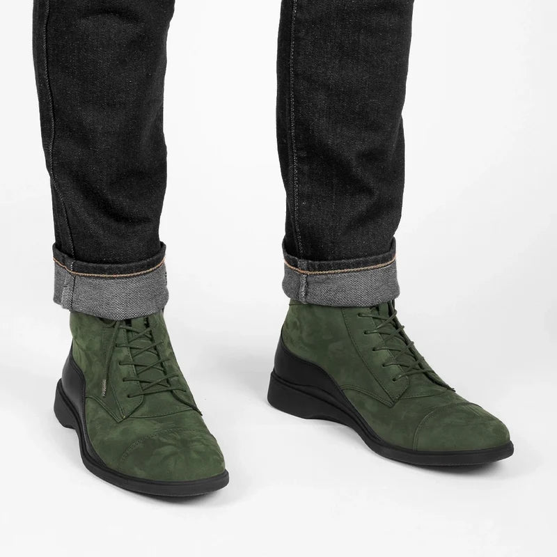 model wearing black jeans with The Boot in Olive Green Nubuck