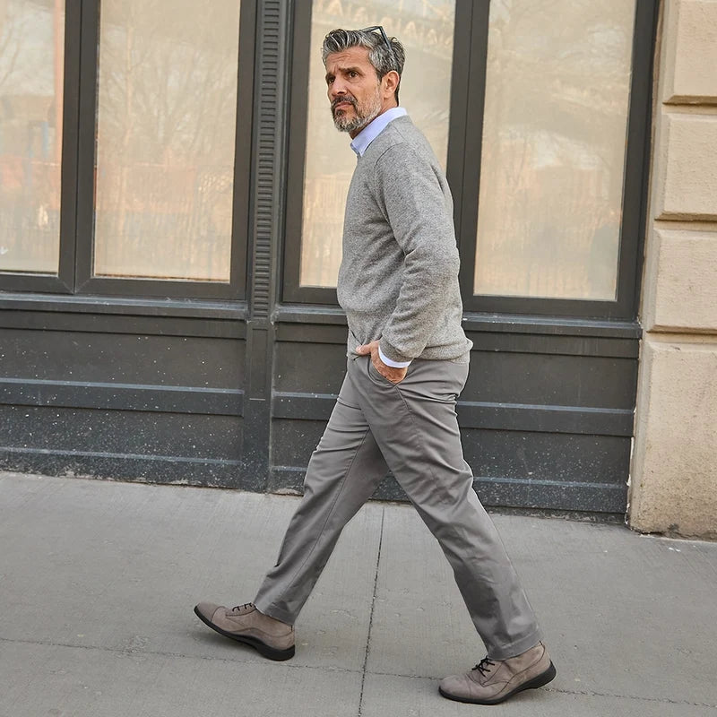 model wearing gray dress pants wearing The Boot in Steel gray nubuck