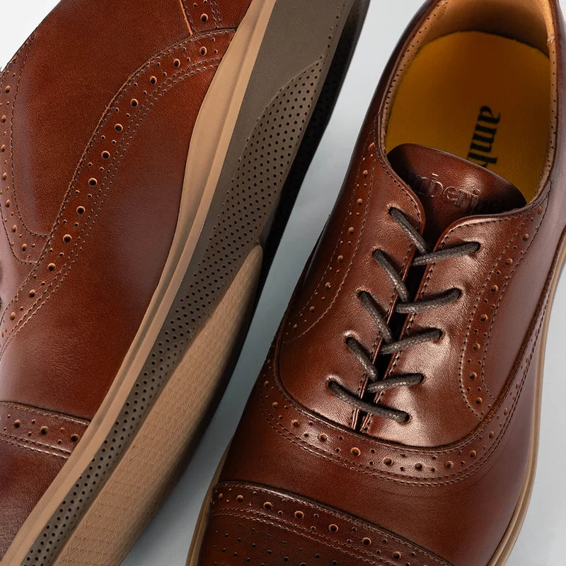 Detail photo of The Cap-Toe in Chestnut Brown Leather showing broguing and laces