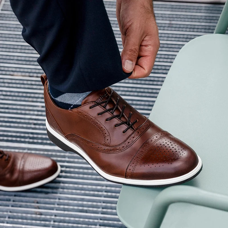 The Cap-Toe in Coffee Brown worn by model wearing dark blue dress pants
