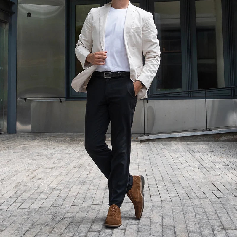 model wearing The Cap-Toe Grizzly paired with dark dress pants and light blazer