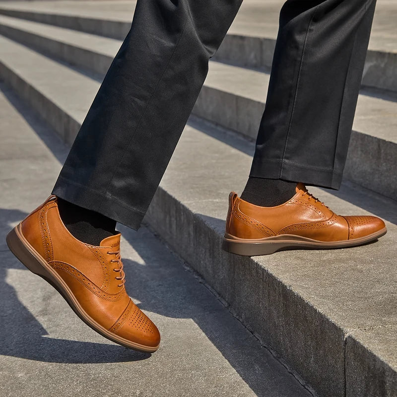 The Cap-Toe in Honey Tan worn by model in dark dress pants