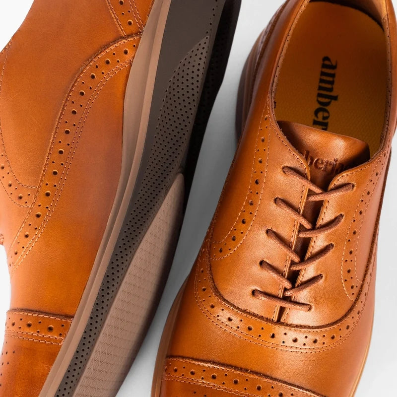 Detail photo of The Cap-Toe in Honey Tan Leather showing broguing and laces