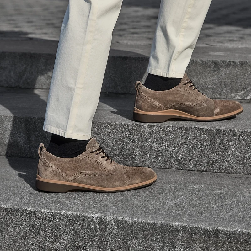 model wearing The Cap-Toe Slate with khaki pants