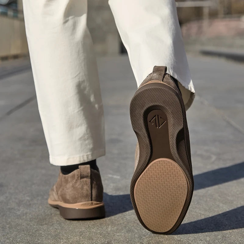 model wearing The Cap-Toe Slate paired with light dress pants