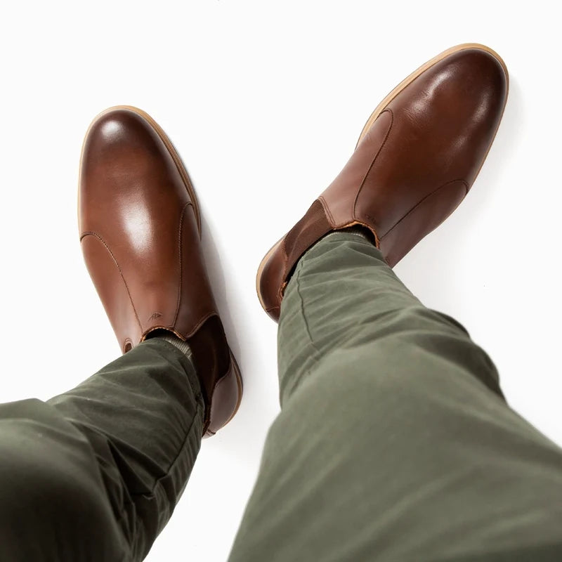 The Chelsea Boot by Amberjack in Chestnut Brown Leather - Worn On Model with Green Pants Top Down View