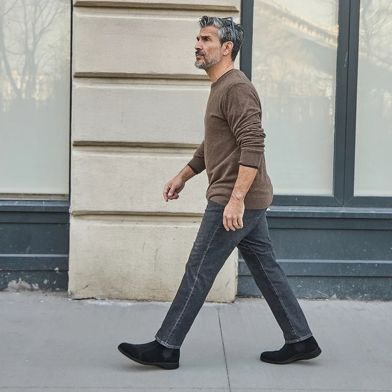 model walking wearing midnight chelsea and dark sweater
