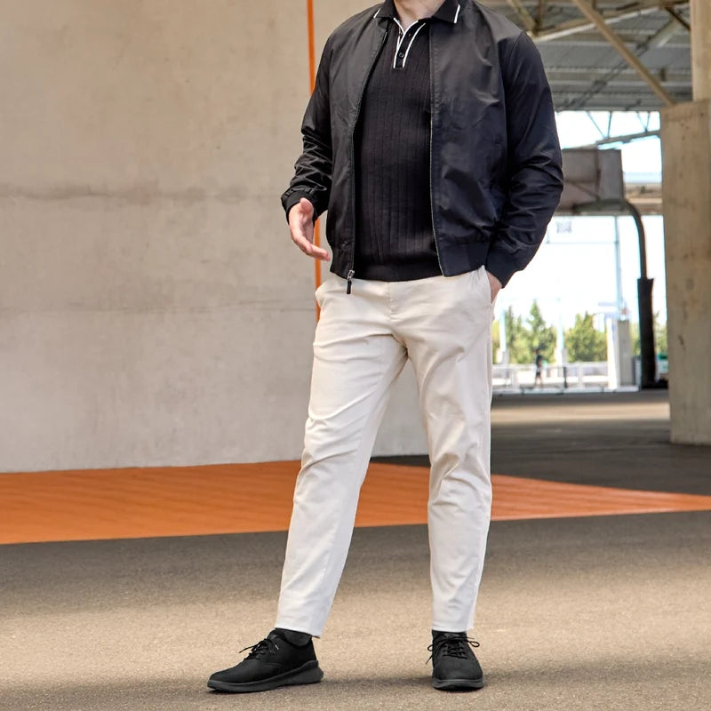 The Hybrid in Midnight Black Nubuck by Amberjack - on model in black polo and khakis pants