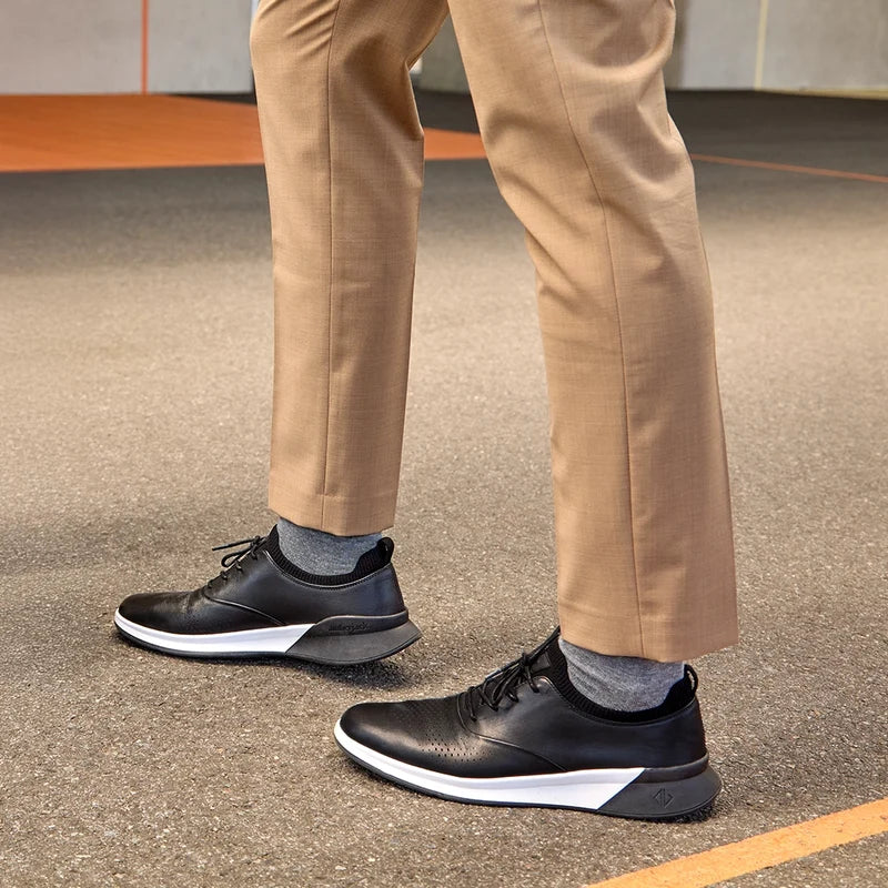 The Hybrid  in Onyx Black by Amberjack - on model wearing khakis pants