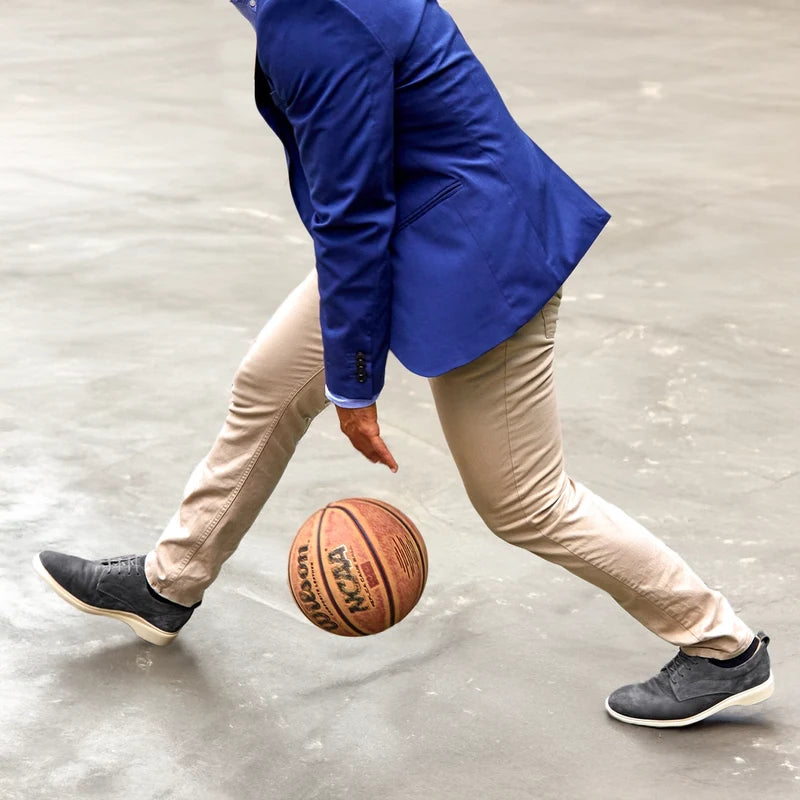 Model playing basketball wearing the OG in Carbon grey suede