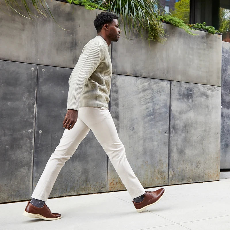 Model walking wearing The Original Chestnut & Cream paired with light pants