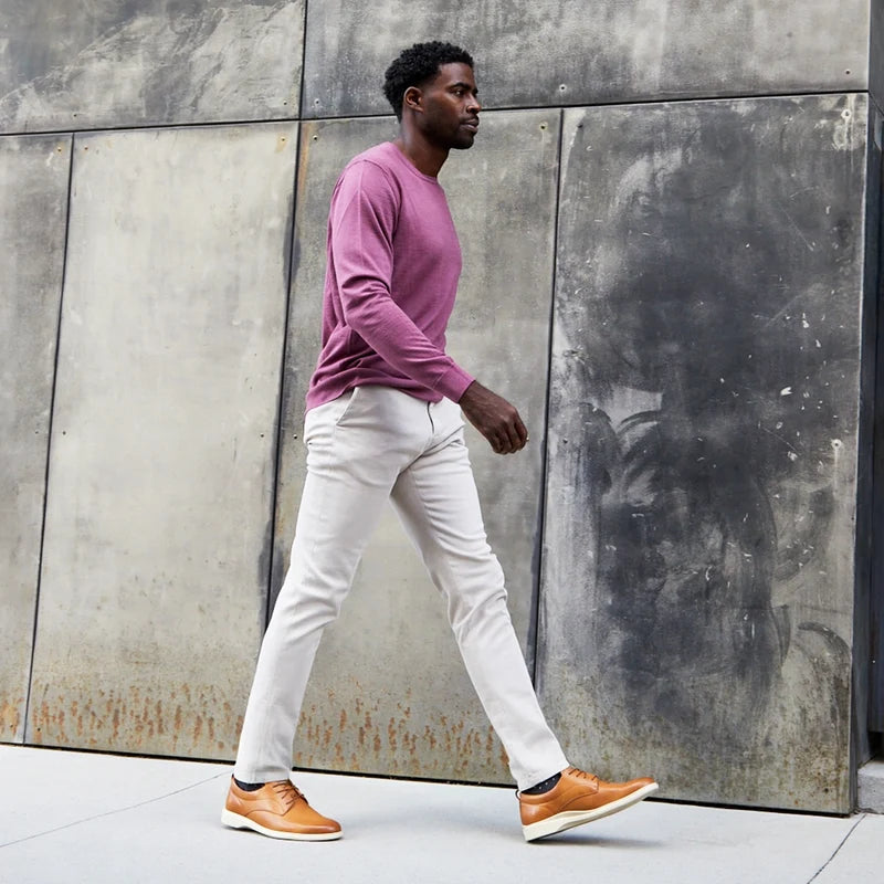 The Original Dress Shoe by Amberjack in Honey & Cream Tan Leather - worn with tan pants on model running