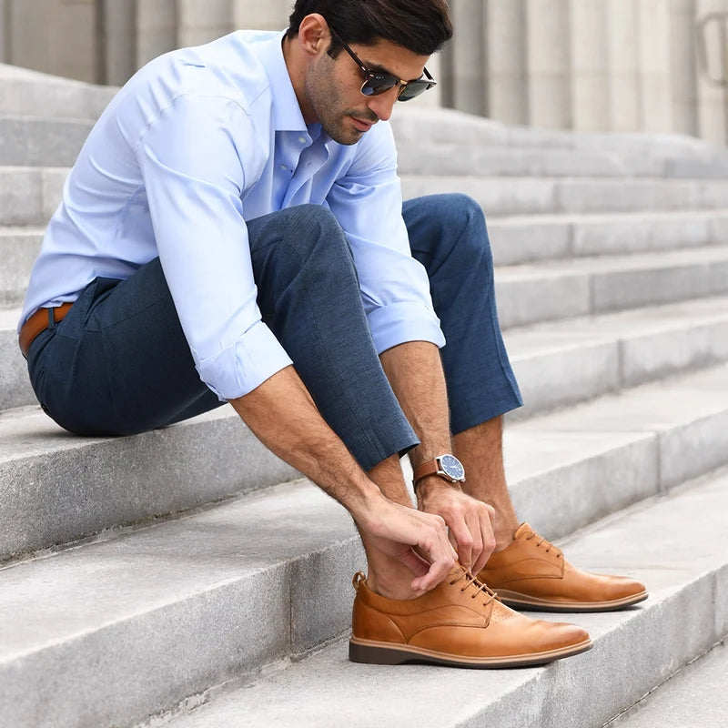The Original Dress Shoe by Amberjack in Honey Tan - on model tying laces