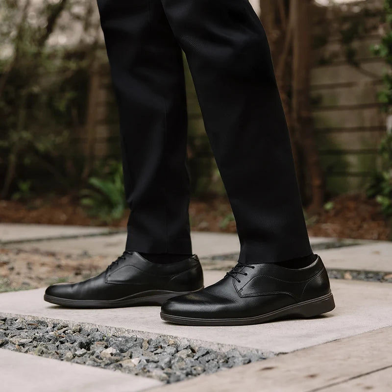 Model wearing The Original Classic in Obsidian with dark dress pants