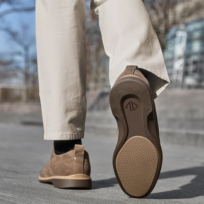 model showing outsole of The Original Slate paired with light dress pants