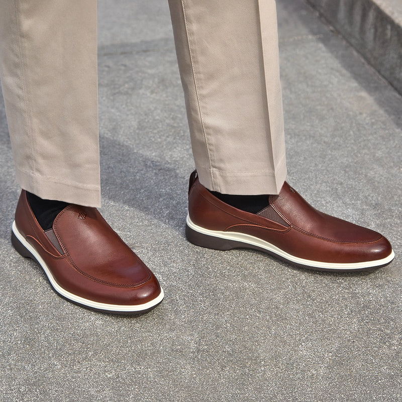 Model wearing The Slip-On in Coffee paired with light dress pants