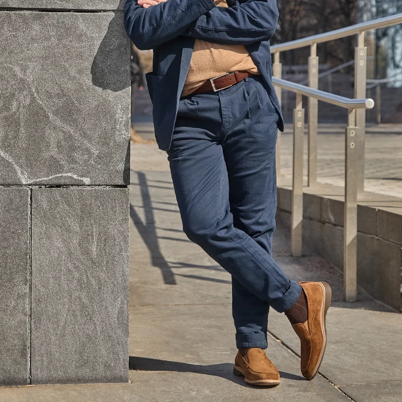 Model wearing The Slip-On Grizzly paired with navy dress pants