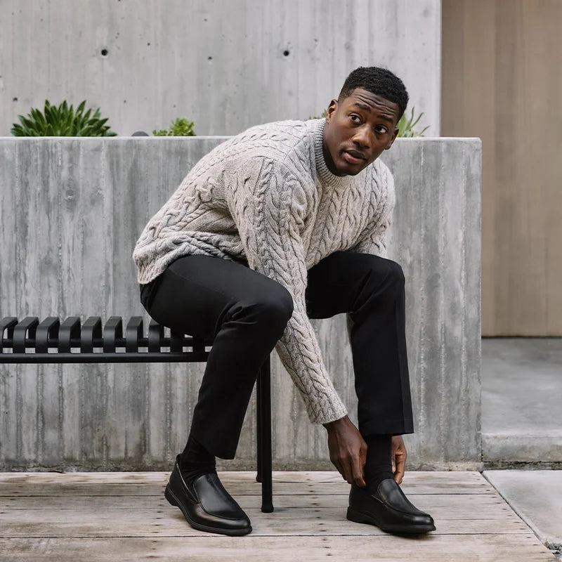 The Slip-On by Amberjack in Obsidian Leather - Worn with black Dress Pants and sweater