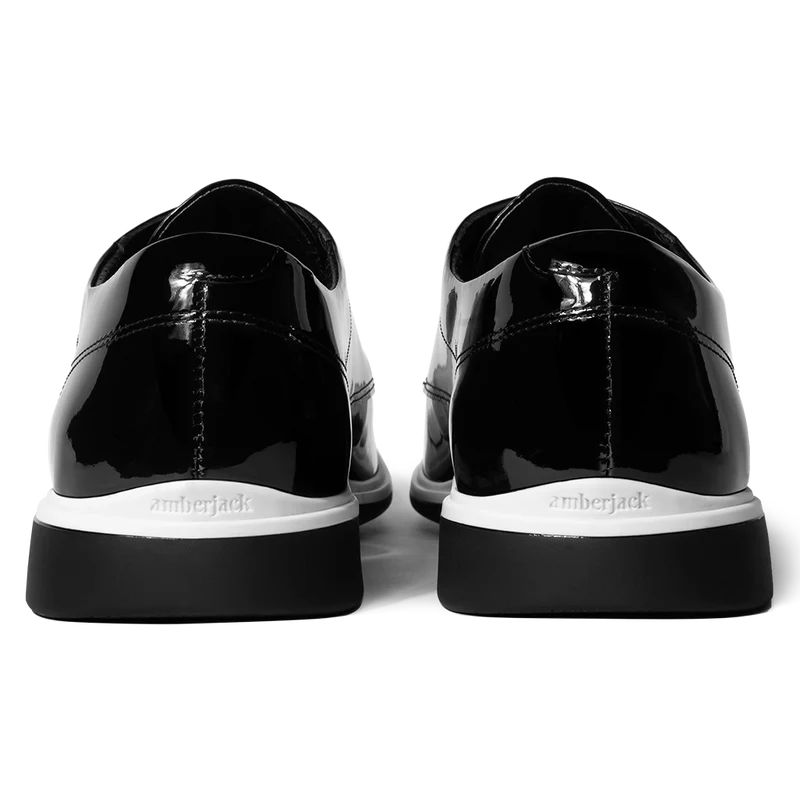 The Tux Dress Shoe by Amberjack in Onyx Black & White Patent Leather - Back Heel View