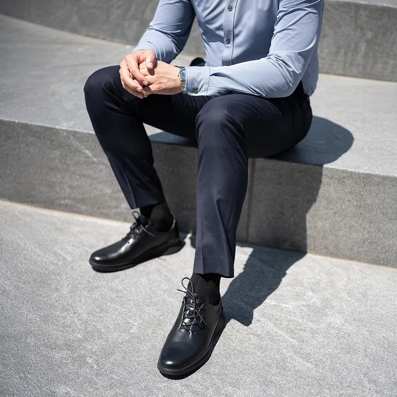 Whole Cut Hybrid Obsidian worn by model with dark blue dress pants and button up shirt